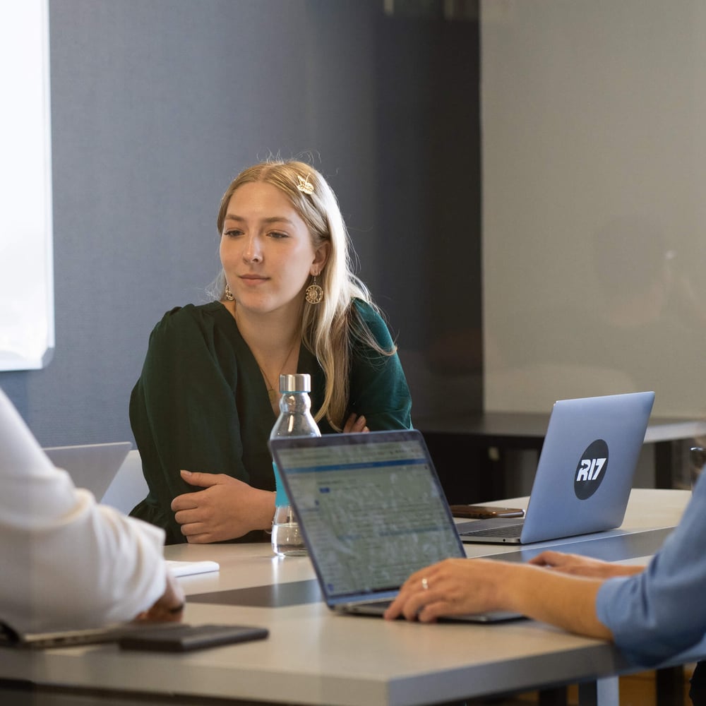Performance Marketer from R17 Ventures in a meeting room.